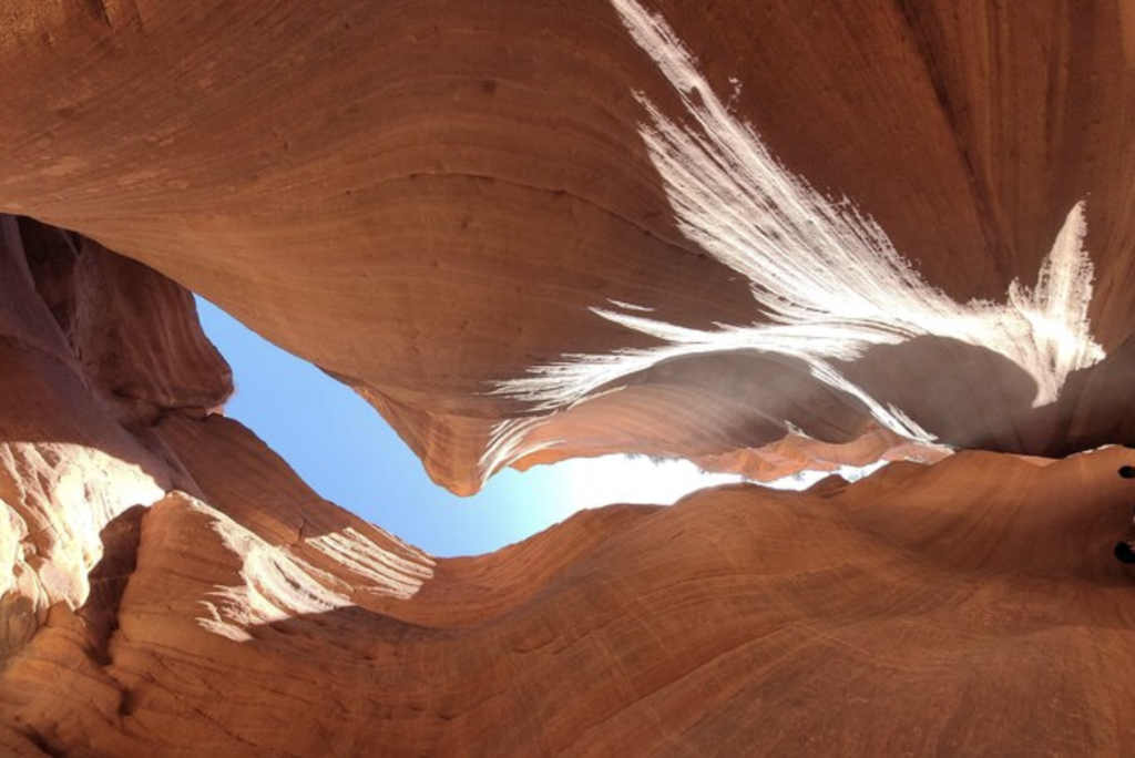 Sunlight filtering into Peek-A-Boo Slot Canyon