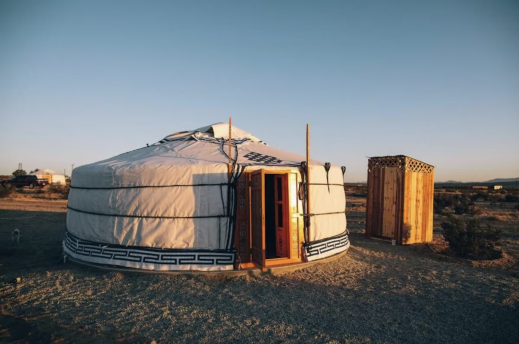 Stargazing yurts under a blue sky