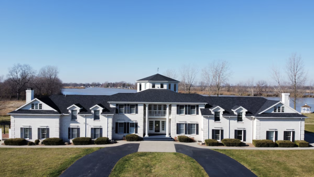 exterior photo of the grand and impressive executive home on the Sandusky River