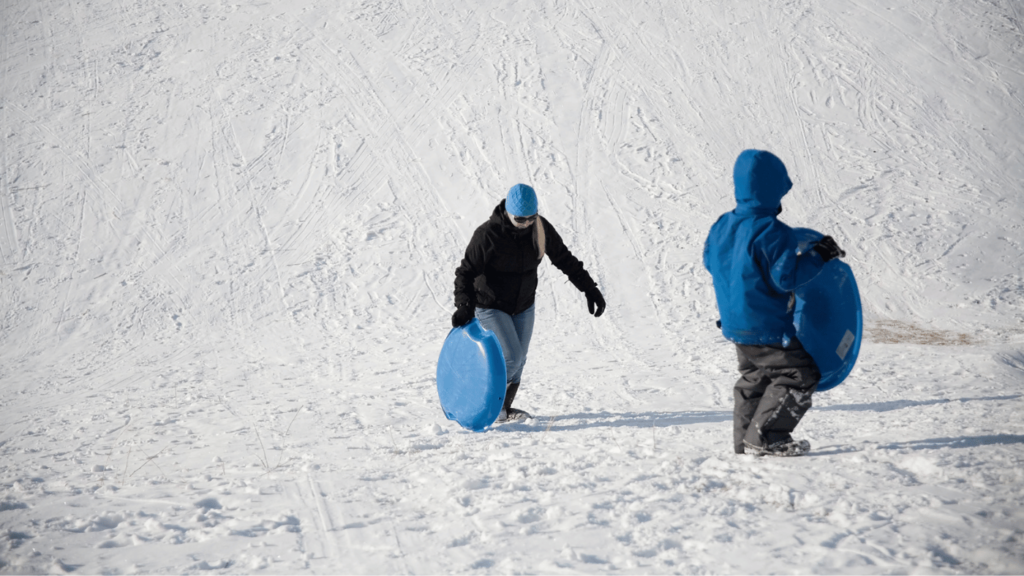 People sledding at Courthouse Hill