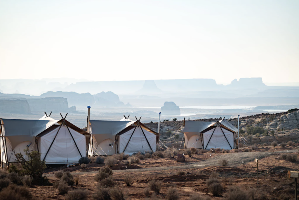 Luxurious tent accommodations with stunning desert landscape in the background